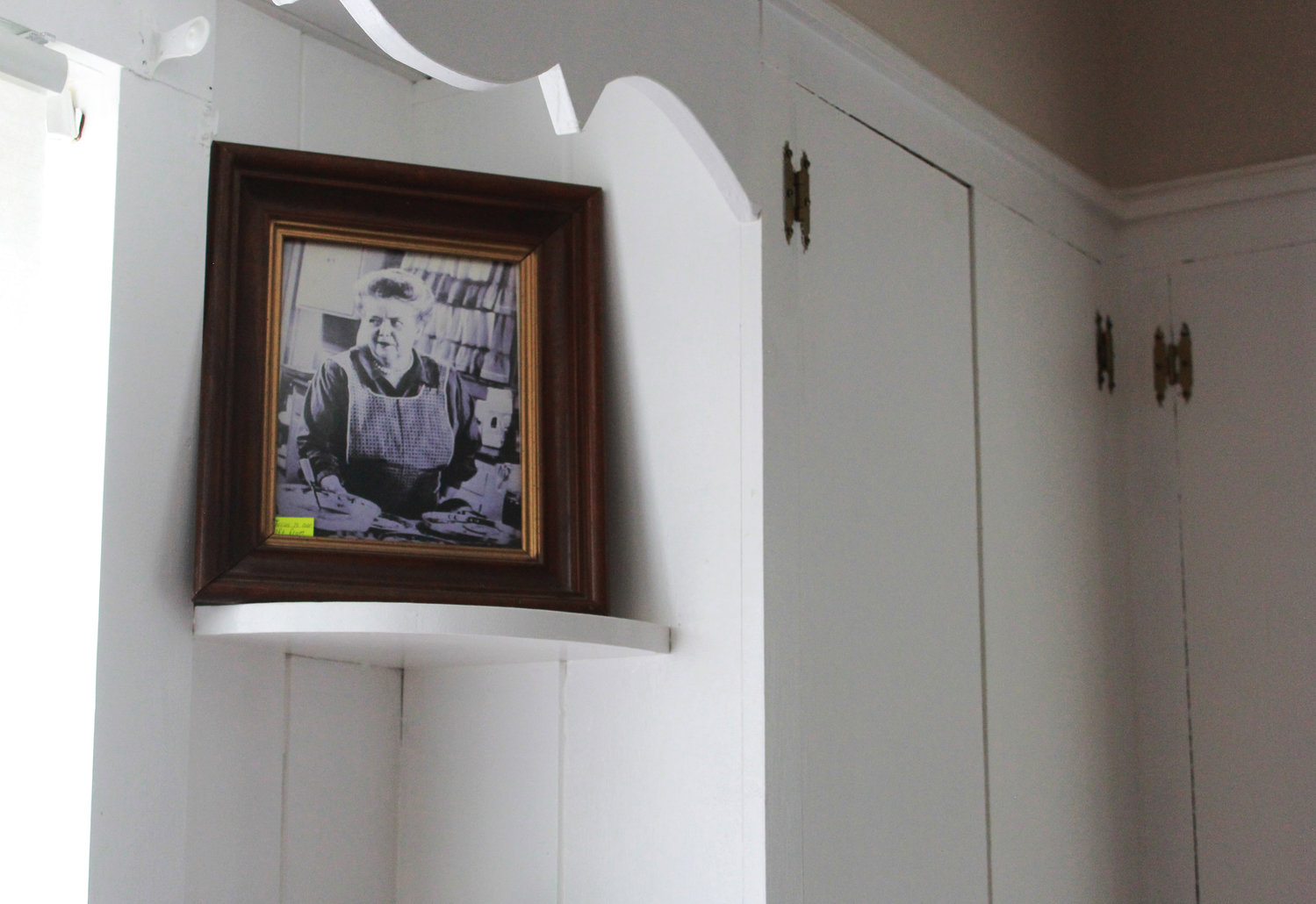 A portrait of former house owner and actress Frances Bavier sits on a shelf in the kitchen of the property formerly known as Aunt Bee’s house in Siler City.
